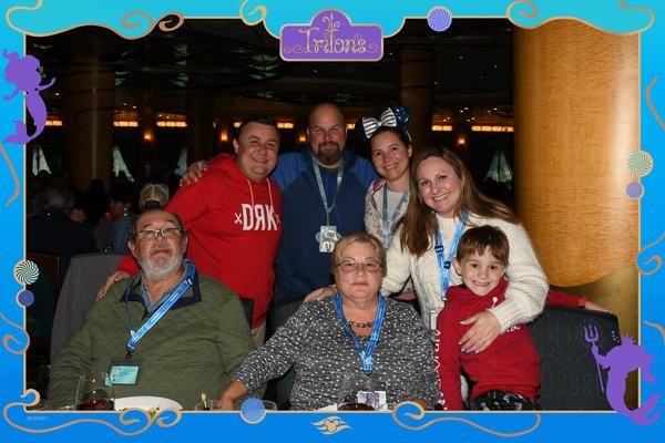 The whole family at dinner on the Disney Wonder