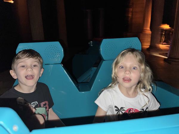 Bennett and Mia on the Spaceship Earth ride at EPCOT