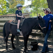 thumbnail for Bennett on a pony ride at Lawton Stables