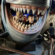 thumbnail for Mia and Bennett in a sharks head at the aquarium inside The Seas with Nemo & Friends at EPCOT