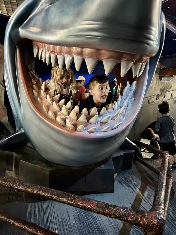 Mia and Bennett in a sharks head at the aquarium inside The Seas with Nemo & Friends at EPCOT