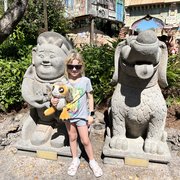 thumbnail for Mia in Asia in front of statues at Animal Kingdom in Walt Disney World