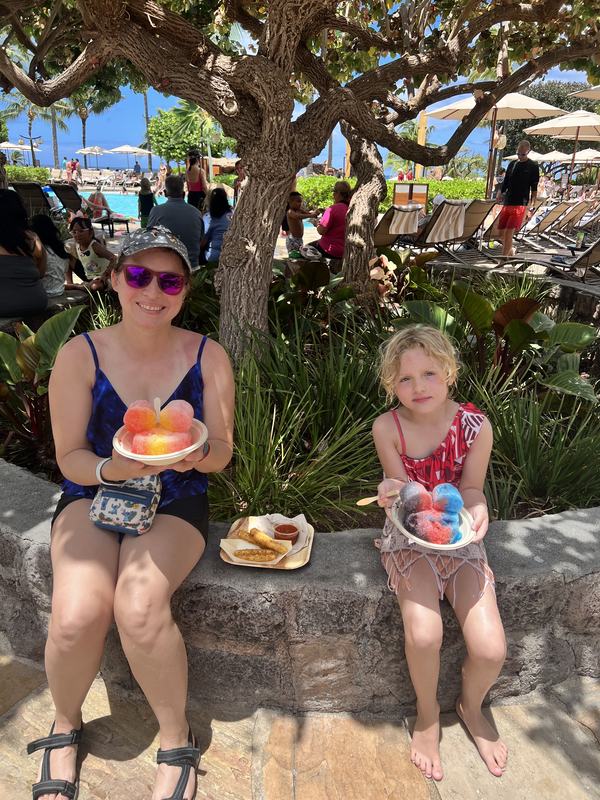 Kati and Mia eating Hawaiian shaved ice at Aulani