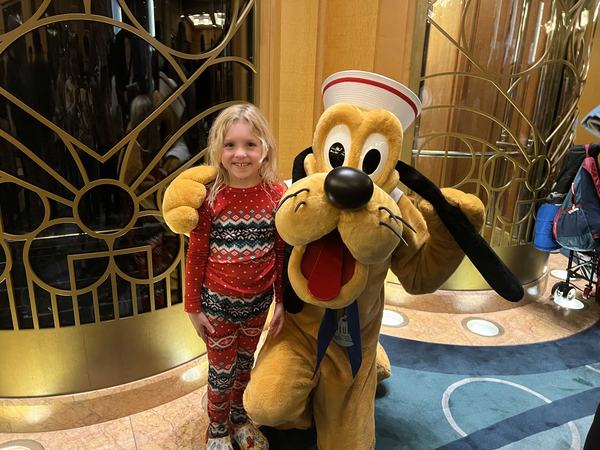 Mia with Pluto on the Disney Wonder