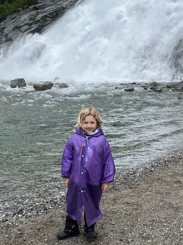 Mia at the waterfall near the Mendenhall Glacier in Juneau