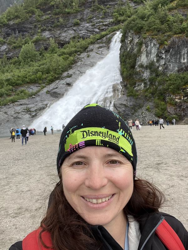Kati at the waterfall near the Mendenhall Glacier in Juneau