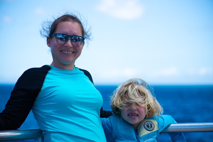 Kati and Mia on a boat looking for wildlife