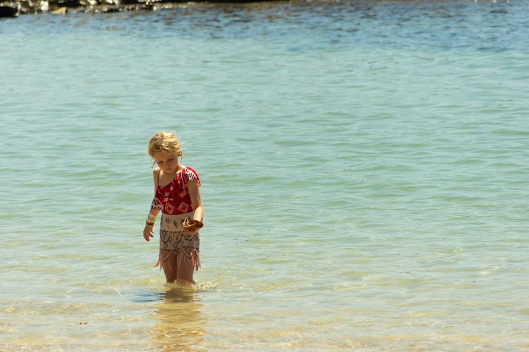 Mia exploring the beach at Lanikuhonua Lagoon near Aulani on Oahu