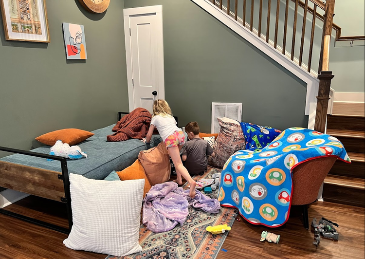 Mia and Bennett building a fort at the AirBnB in Atlanta