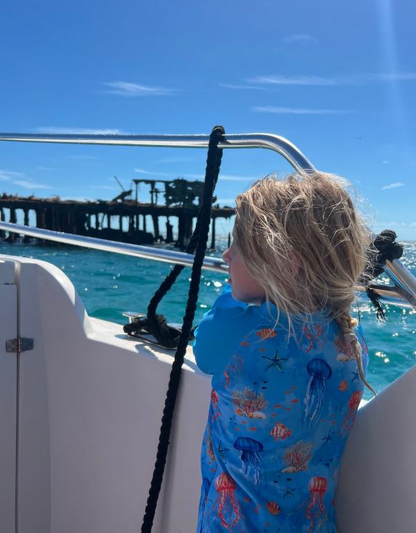 Mia in the boat near the SS Sapona