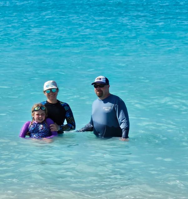 Mia, Kati, and James in the ocean near the beach in Bimini