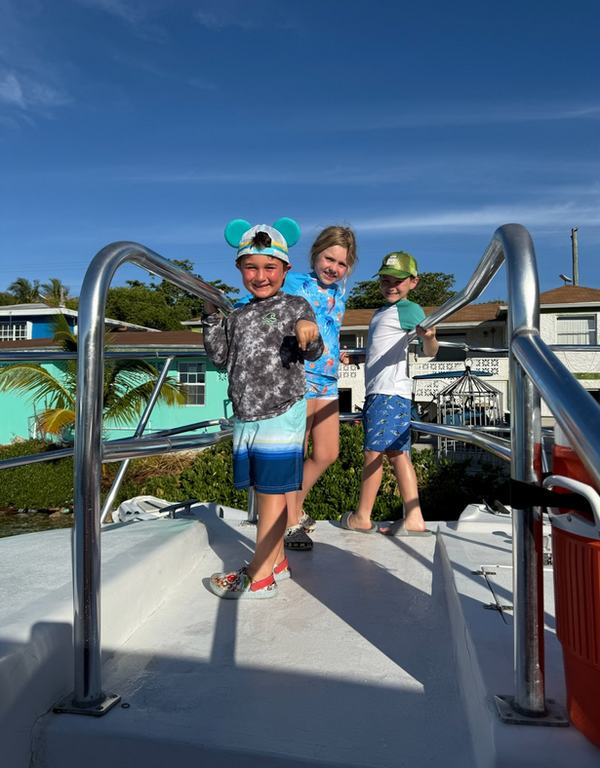Tav, Mia, Bennett on the boat at Big Game Club
